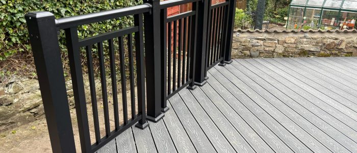 Black metal balustrade on a grey composite decking